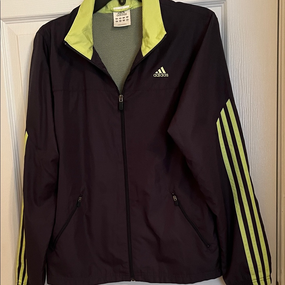 Adidas Blue jacket with lime green stripes.